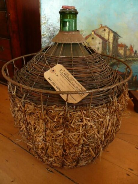 Antique French wine bottle/liquid container in original metal casing