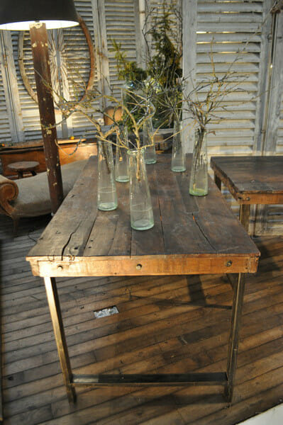 Pair of industrial workbench tables with old wooden tops