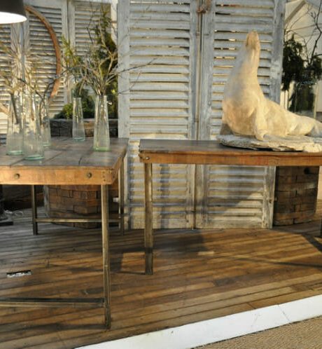 Pair of industrial workbench tables with old wooden tops