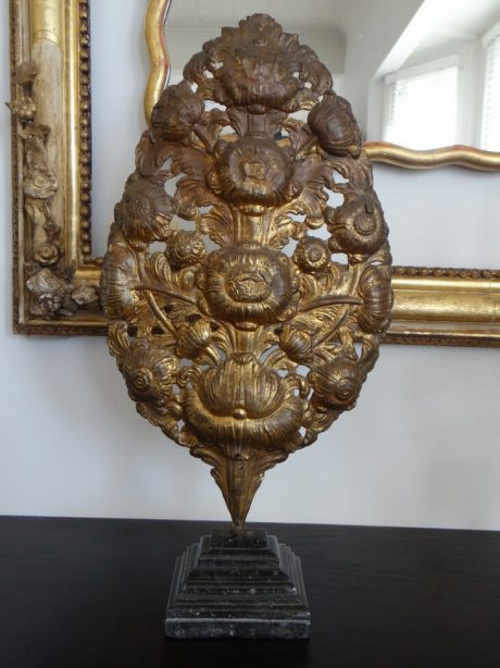 Floral pressed brass decoration mounted on a stand c.1910