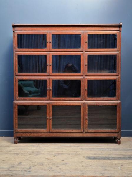 Large oak Mintys Oxford glazed stacking bookcase c.1930