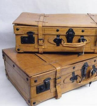 A set of two pig skin leather gentlemans suitcases