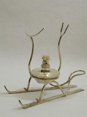 Silver plated brandy glass warmer in the form of two skis