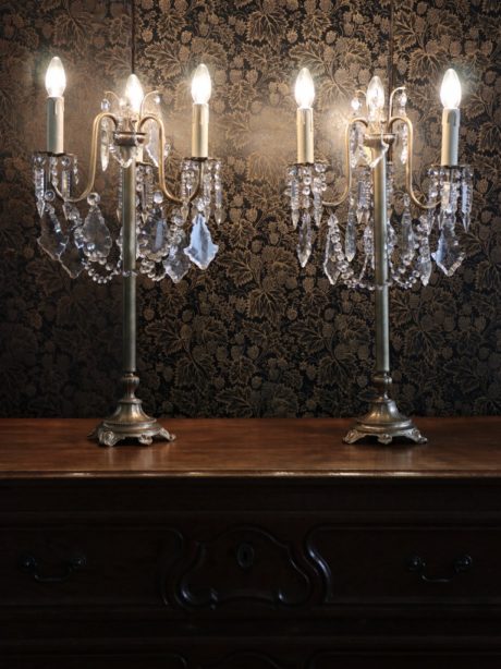 Pair of lead crystal and brass three arm lamps