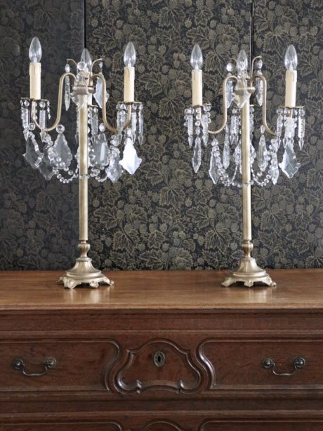 Pair of lead crystal and brass three arm lamps