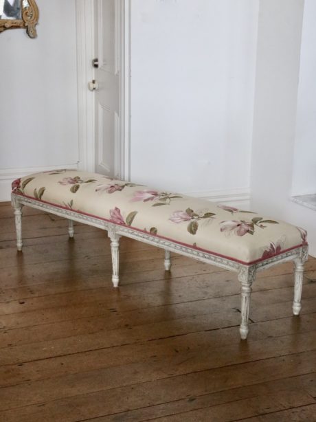 A painted Louis XVI style upholstered bench