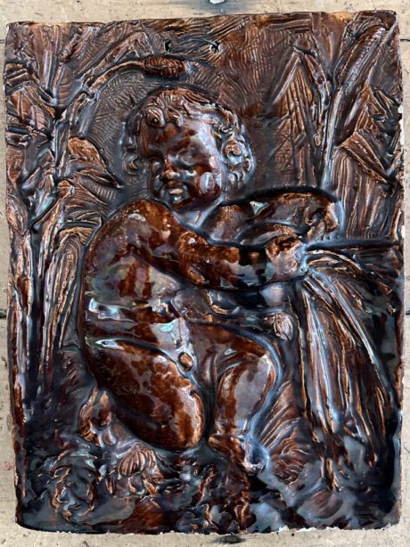 Glazed terracotta relief signed and dated 1880