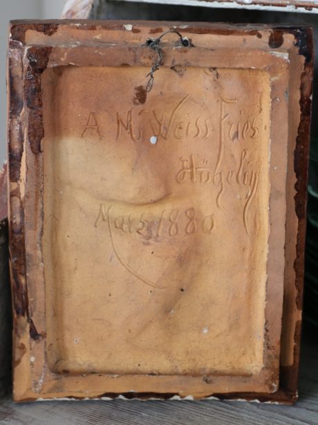 Glazed terracotta relief signed and dated 1880