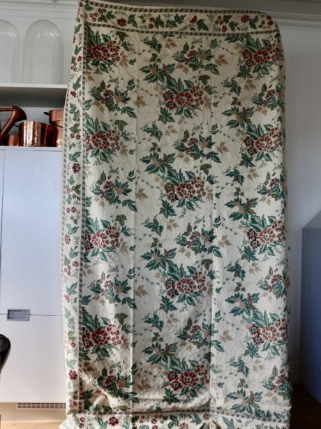 A crewel work wall hanging or bed covering