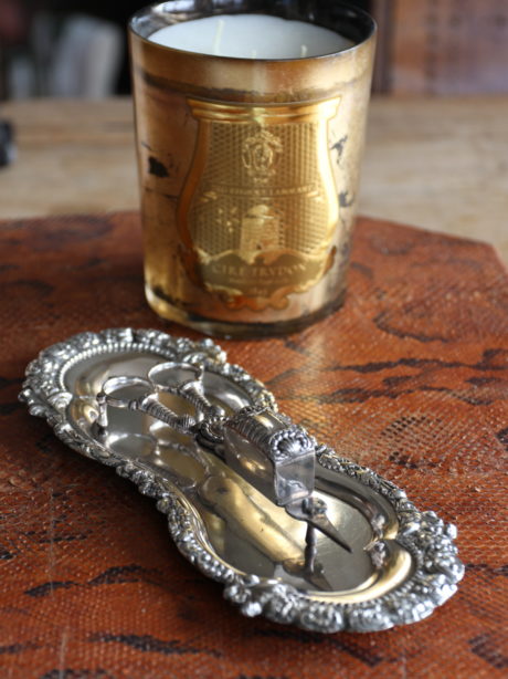 An antique silver plate candle snuffer with tray