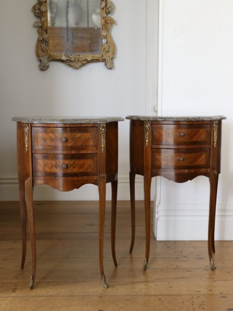 A pair of Louis XV style bedside tables