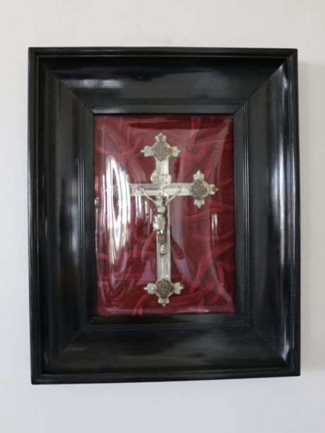 Antique silver plated crucifix under convex glass