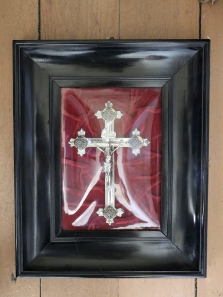 Antique silver plated crucifix under convex glass