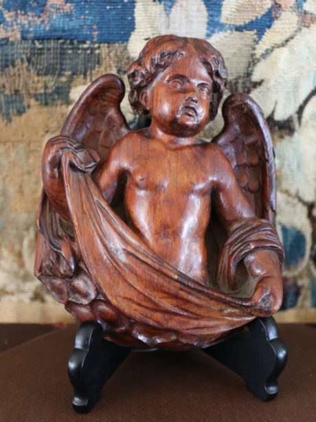 Antique walnut hand carved winged cherub