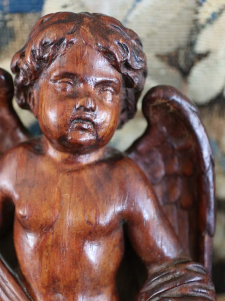 Antique walnut hand carved winged cherub
