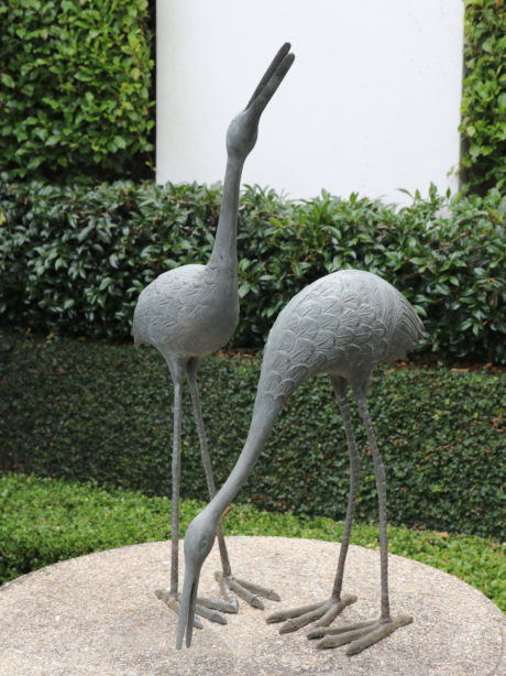 A pair of decorative bronze crane birds